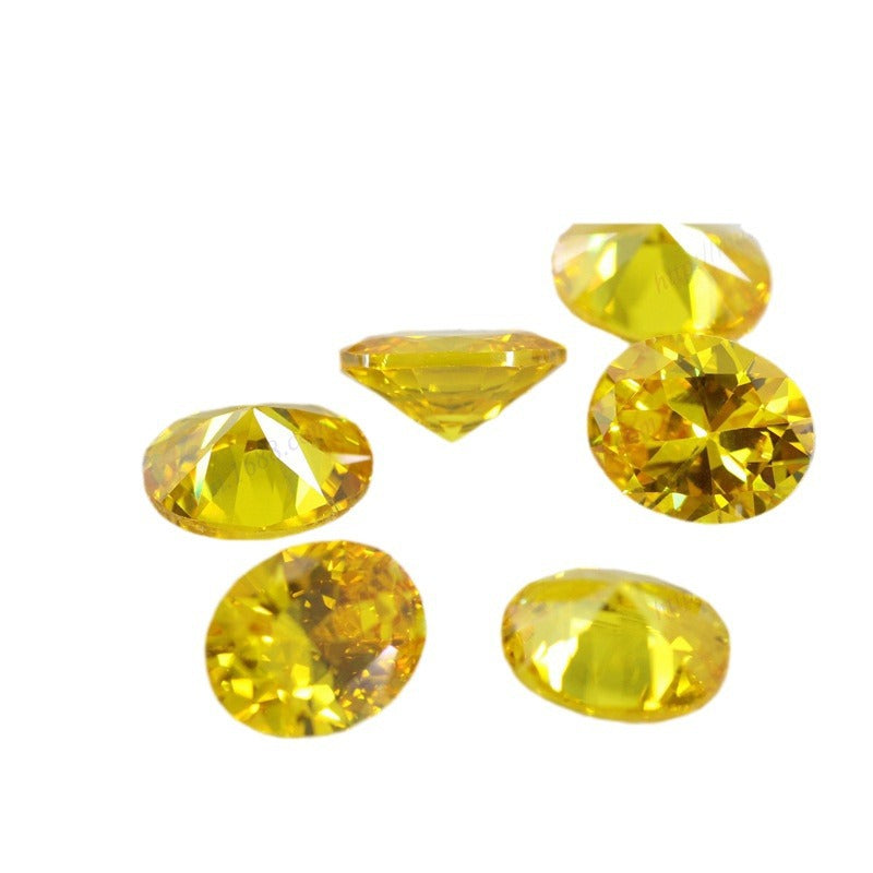蛋形金黄色锆石裸石戒面 椭圆形立方氧化锆梧州批发AAA